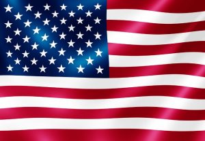 Flagge USA (weiße Sterne auf blauem Hintergrund, daneben rot-weiße Streifen)